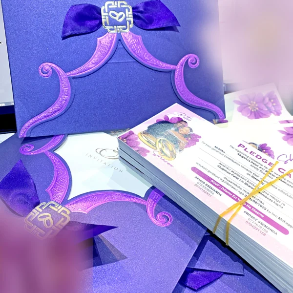 Petal Romantic Wedding Cards in Uganda—elegant maroon and purple invitation cards with a petal-fold design, perfect for stylish, intimate, or luxury-themed wedding celebrations.