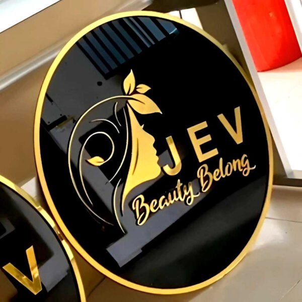 3D Acrylic Gold Signage with glossy black background and gold raised lettering and logo details, ideal for beauty brands, salons, boutiques, corporate brand identity display, indoor brand walls and premium shop front signage.