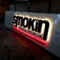 3D illuminated signage with raised black letters and LED backlighting featuring warm glow and red accent strip, ideal for restaurants, cafes, bars and premium commercial branding installations.